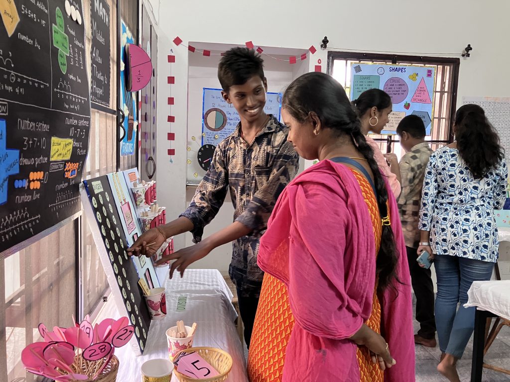 boy explaining his project to the girl